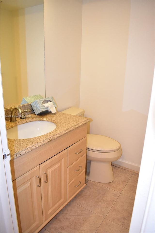 3970 Oaks Clubhouse Dr Unit 307, Pompano Beach, FL 33069 - bathroom featuring vanity, toilet, tile patterned flooring, and baseboards