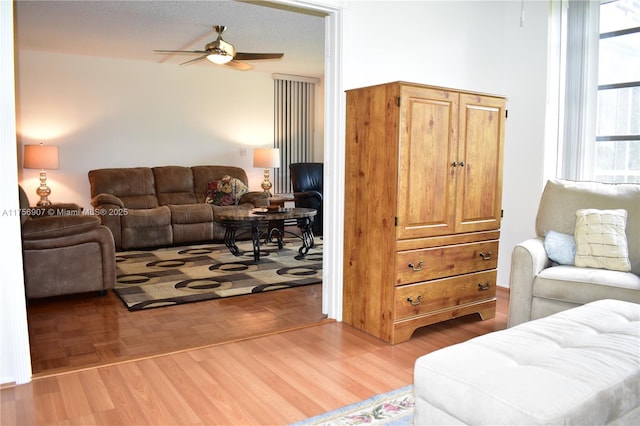 3970 Oaks Clubhouse Dr Unit 307, Pompano Beach, FL 33069 - living room featuring a ceiling fan and light wood-style flooring