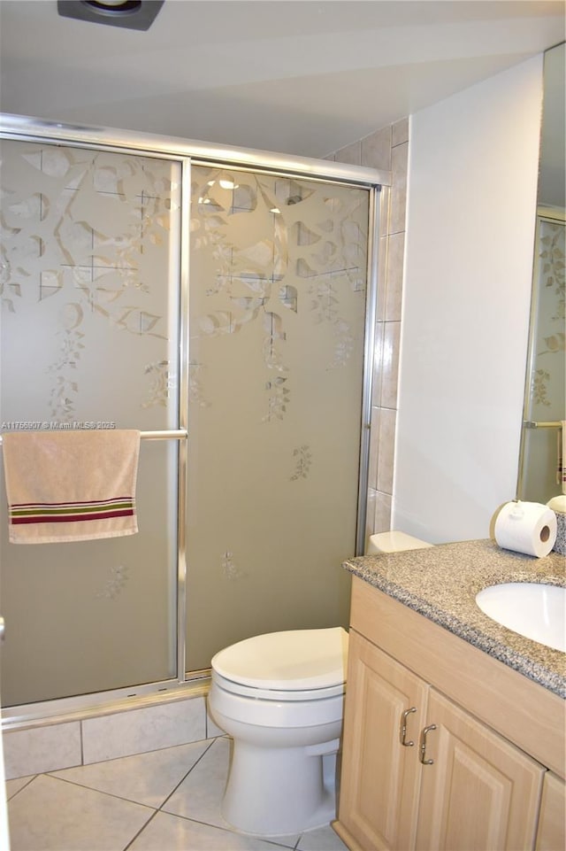 3970 Oaks Clubhouse Dr Unit 307, Pompano Beach, FL 33069 - full bath featuring tile patterned floors, a stall shower, toilet, and vanity
