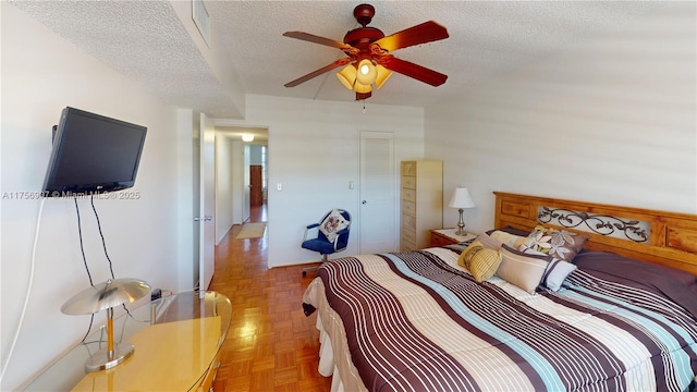 3970 Oaks Clubhouse Dr Unit 307, Pompano Beach, FL 33069 - bedroom with a textured ceiling and a ceiling fan