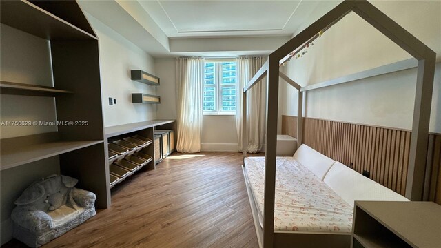 20000 E Country Club Dr Unit 1016, Aventura, FL 33180 - bedroom with wainscoting and wood finished floors