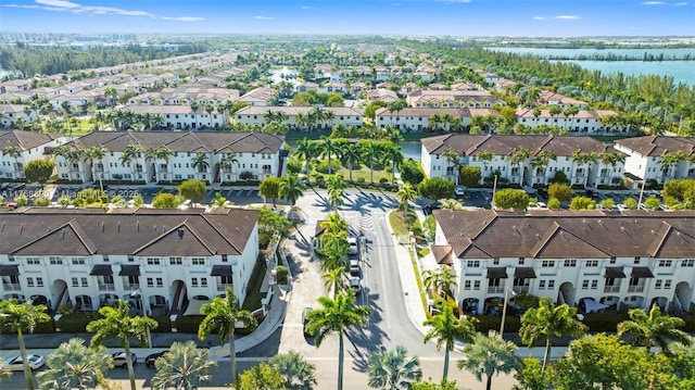 birds eye view of property with a residential view and a water view