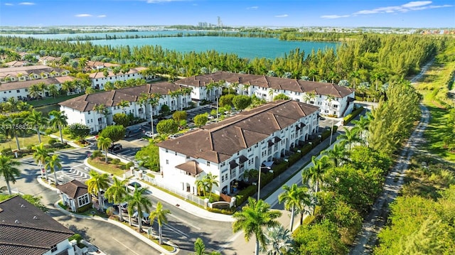 bird's eye view featuring a residential view and a water view