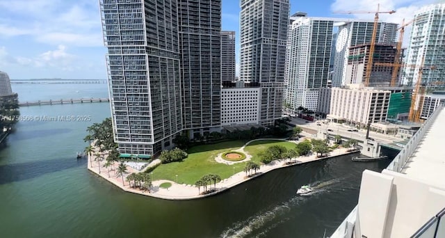 property's view of city featuring a water view