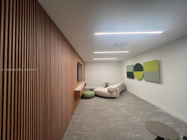 sitting room with visible vents and baseboards