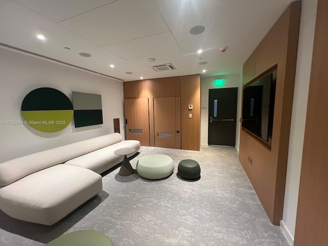 living room featuring visible vents, concrete flooring, and recessed lighting