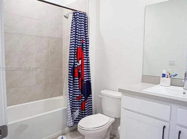 bathroom featuring vanity, shower / bath combination with curtain, and toilet