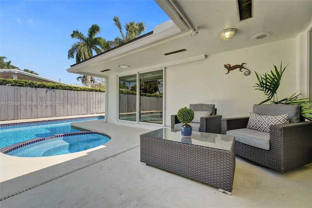 2817 NE 26th St, Fort Lauderdale, FL 33305 - view of swimming pool with a pool with connected hot tub, fence, and a patio