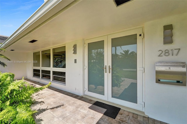 2817 NE 26th St, Fort Lauderdale, FL 33305 - entrance to property with french doors and stucco siding