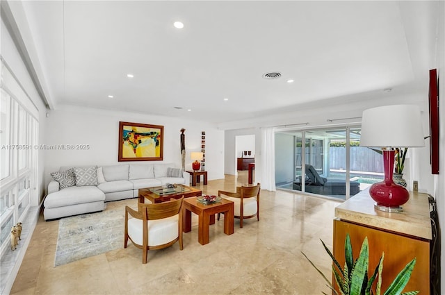 living area featuring visible vents and recessed lighting