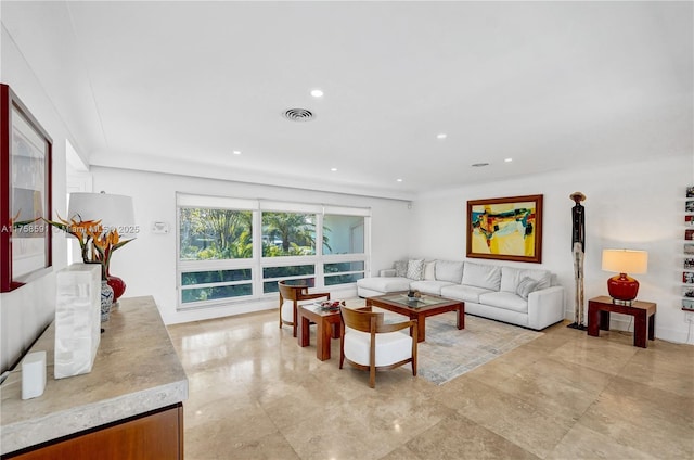 living area with recessed lighting and visible vents