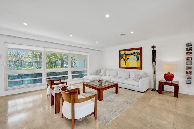 living area featuring recessed lighting and visible vents