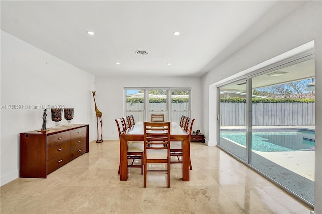 dining room with recessed lighting, a healthy amount of sunlight, visible vents, and baseboards