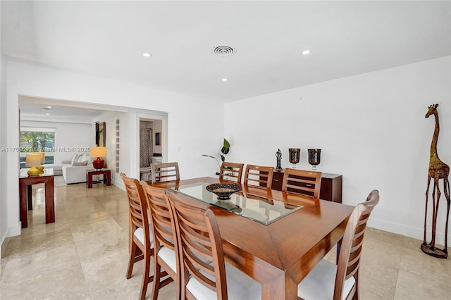 dining room with baseboards, visible vents, and recessed lighting