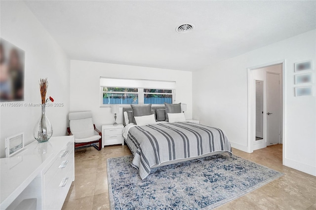 bedroom with visible vents and baseboards