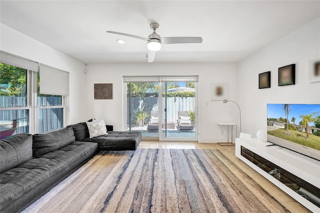 2817 NE 26th St, Fort Lauderdale, FL 33305 - living room featuring baseboards and a ceiling fan