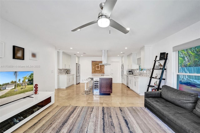 living room with a ceiling fan and recessed lighting