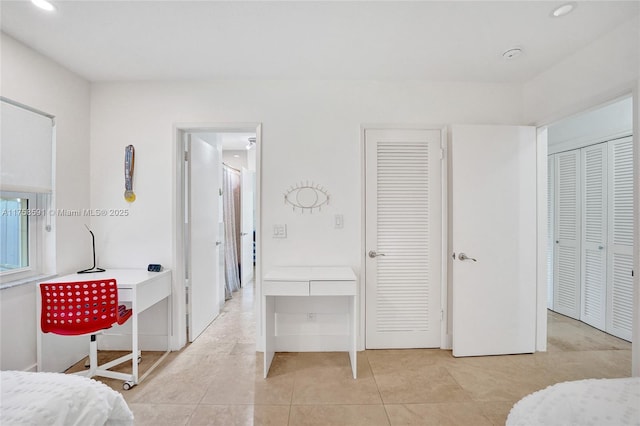 bedroom featuring light tile patterned flooring