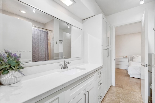 ensuite bathroom featuring vanity and ensuite bath