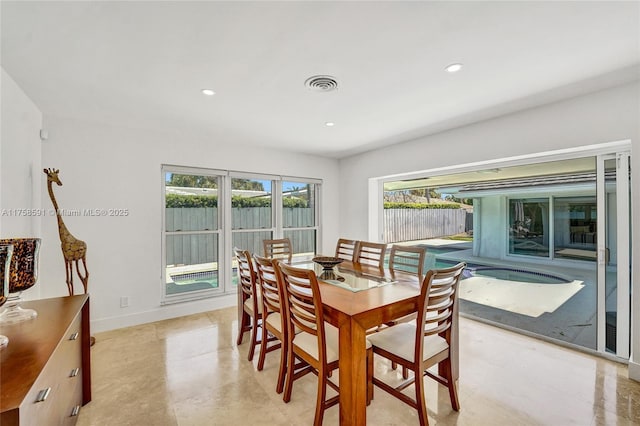 dining area with baseboards, visible vents, and recessed lighting