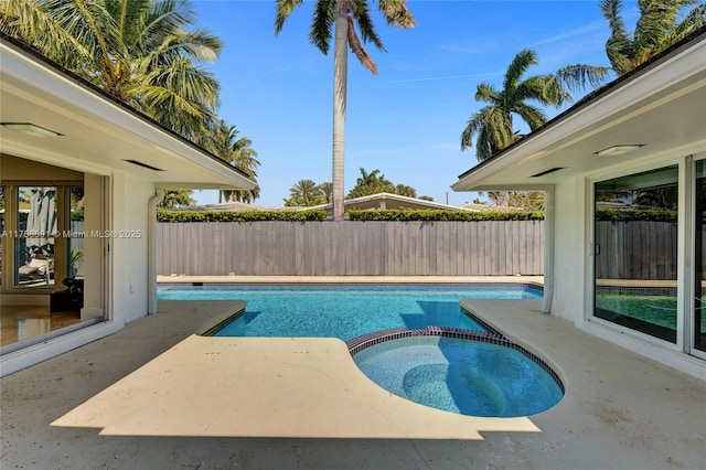 2817 NE 26th St, Fort Lauderdale, FL 33305 - view of swimming pool featuring a patio, a pool with connected hot tub, and fence