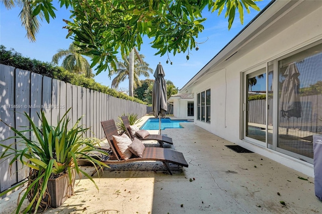 2817 NE 26th St, Fort Lauderdale, FL 33305 - view of swimming pool with a fenced backyard, a fenced in pool, and a patio