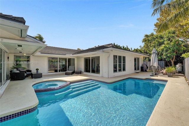 view of swimming pool featuring a pool with connected hot tub, a fenced backyard, a patio, and an outdoor living space