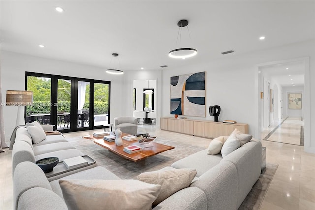 living room featuring visible vents, recessed lighting, and french doors