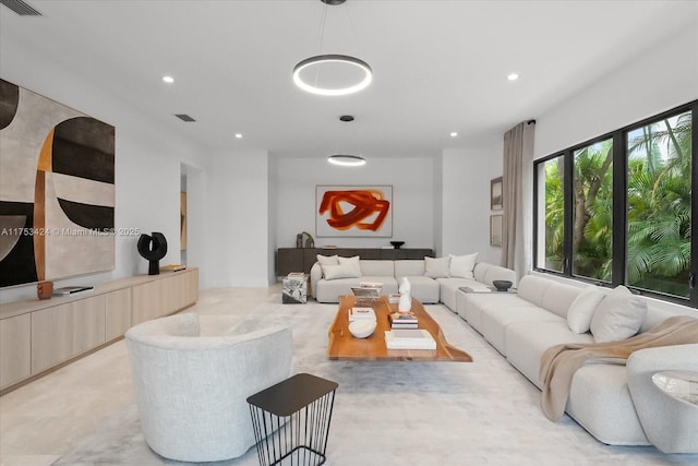 living room with recessed lighting and visible vents