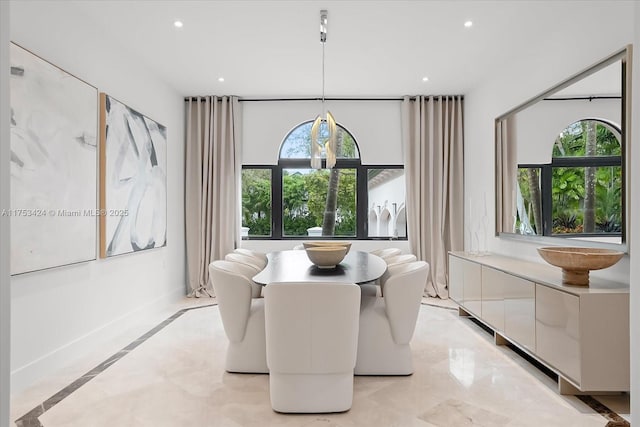 dining area featuring recessed lighting, a healthy amount of sunlight, and baseboards