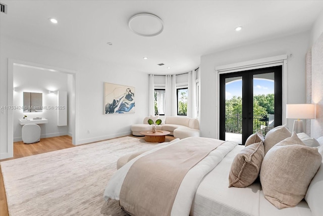 bedroom featuring wood finished floors, visible vents, recessed lighting, access to exterior, and french doors