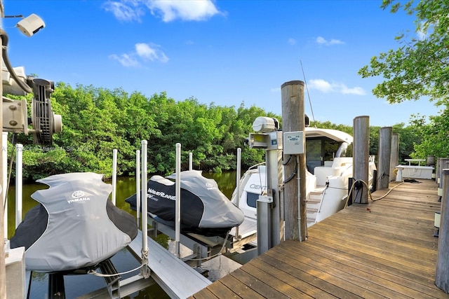 view of dock with boat lift