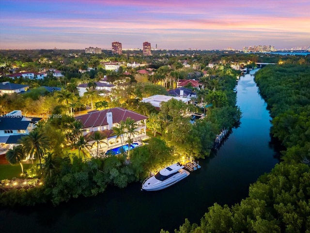 aerial view at dusk with a water view