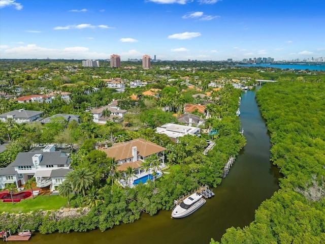 birds eye view of property with a city view and a water view