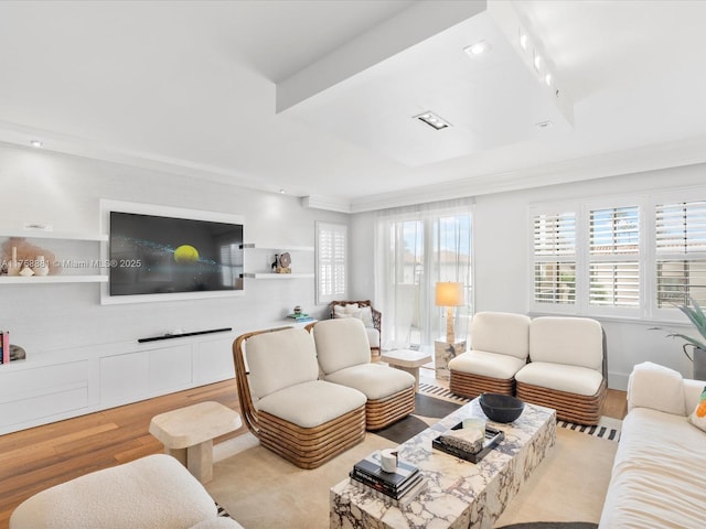 living area featuring wood finished floors and recessed lighting