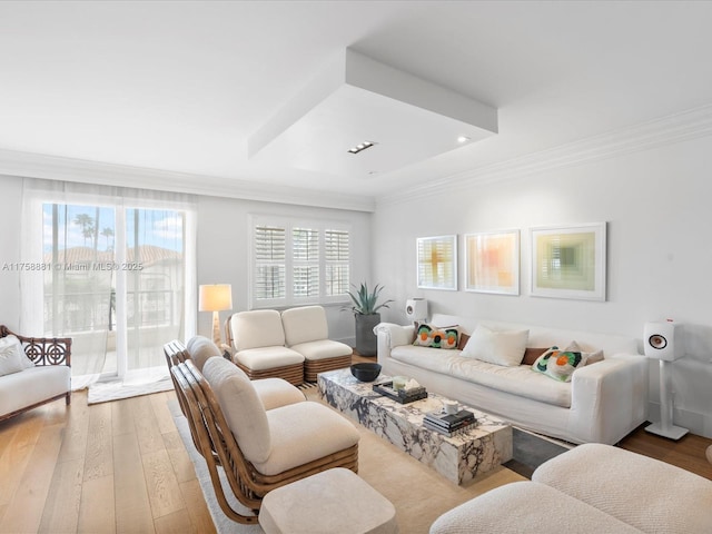 living room featuring ornamental molding, recessed lighting, and wood-type flooring