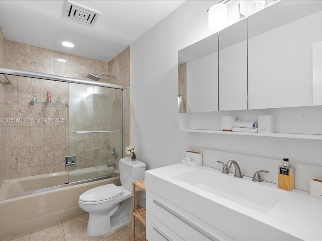 full bath with visible vents, toilet, enclosed tub / shower combo, vanity, and tile patterned floors