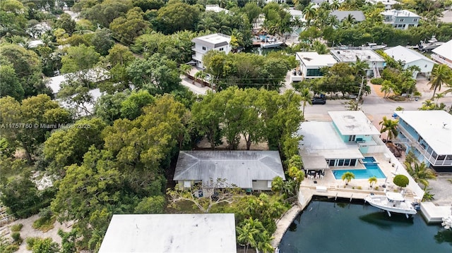 bird's eye view featuring a water view and a residential view