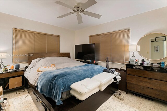 bedroom with ceiling fan and light speckled floor