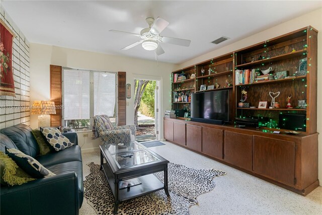 living room with visible vents and ceiling fan