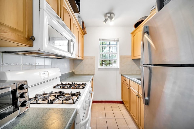 kitchen featuring white appliances, baseboards, light brown cabinets, backsplash, and light tile patterned flooring