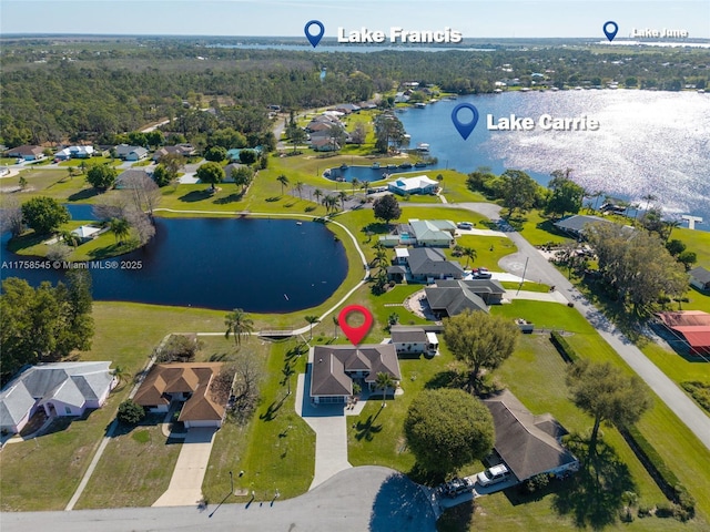 birds eye view of property featuring a residential view and a water view