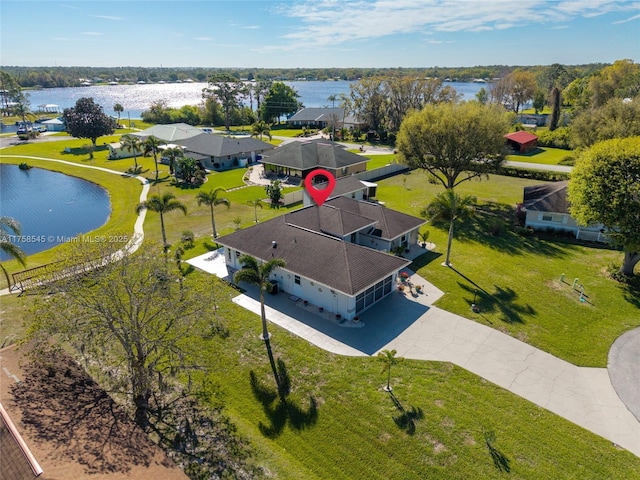 aerial view with a residential view and a water view