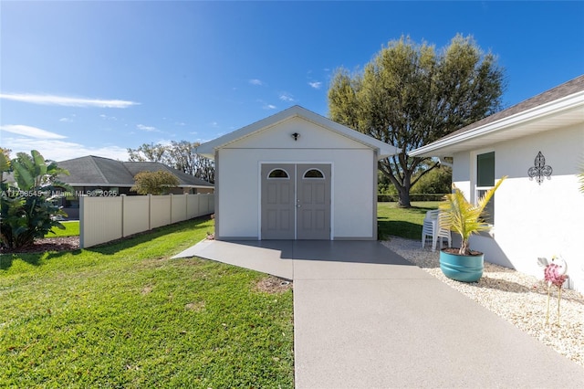 view of shed featuring fence