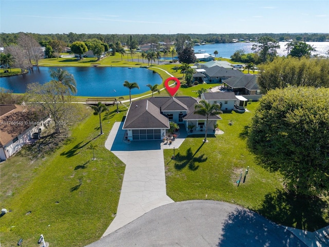 birds eye view of property featuring a water view