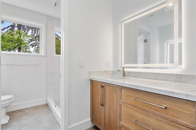 full bathroom with baseboards, toilet, tile patterned flooring, walk in shower, and vanity