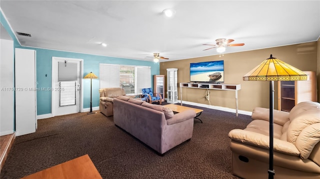 carpeted living area featuring baseboards, visible vents, and ceiling fan