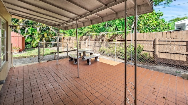 view of patio / terrace featuring fence