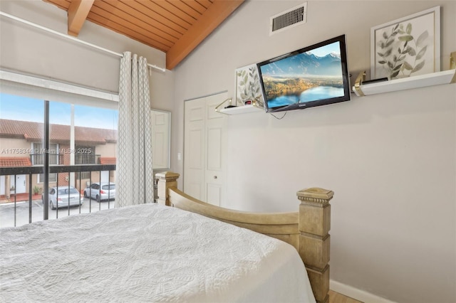 bedroom with visible vents and vaulted ceiling