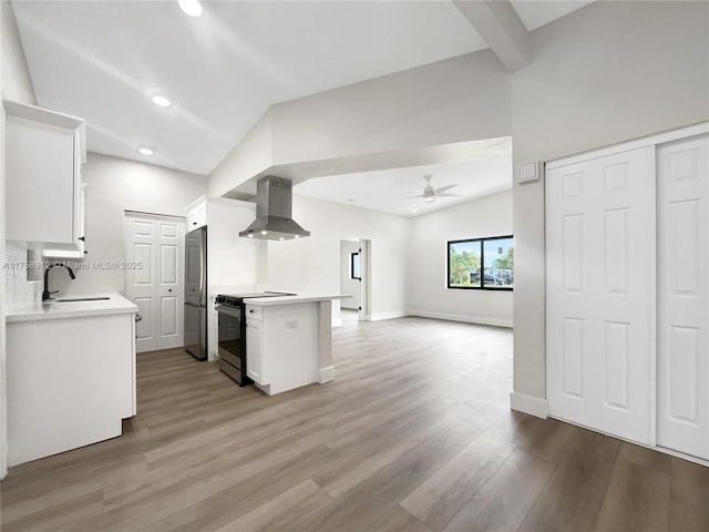 kitchen featuring extractor fan, open floor plan, light countertops, electric stove, and built in fridge